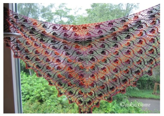 hearts in mesh shawl stretched out and backlit