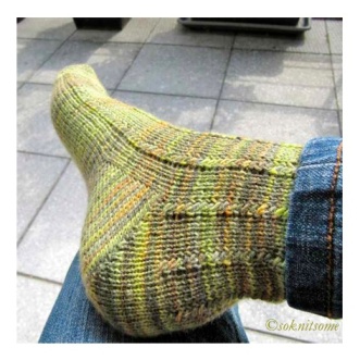 Mixed green textured socks heel close-up
