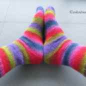 bright striped socks on feet - side view