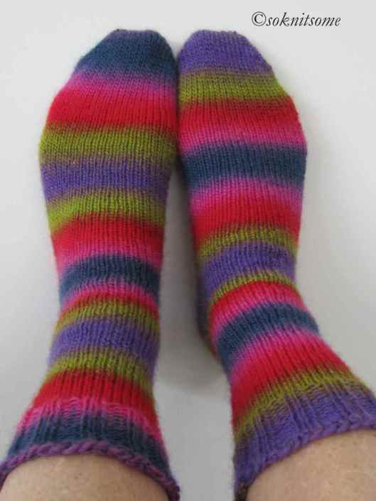 bright striped socks on feet