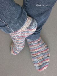 Stripey socks on feet and right heel