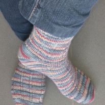 Stripey socks on feet and left heel