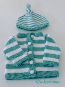 Green and white striped baby cardigan and hat