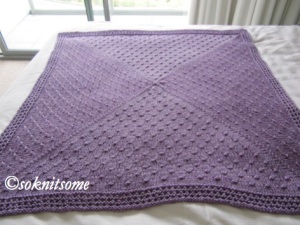 Purple textured baby blanket - flat