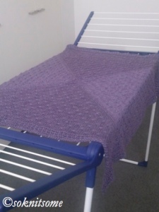 Textured purple baby blanket - drying