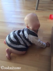 baby girl in grey striped dress